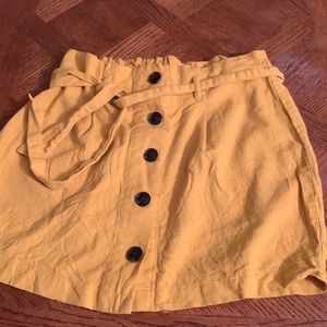 super cute yellow skirt with dark buttons